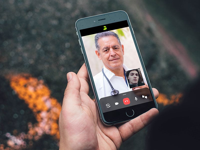 patient and doctor on a video call on a smartphone